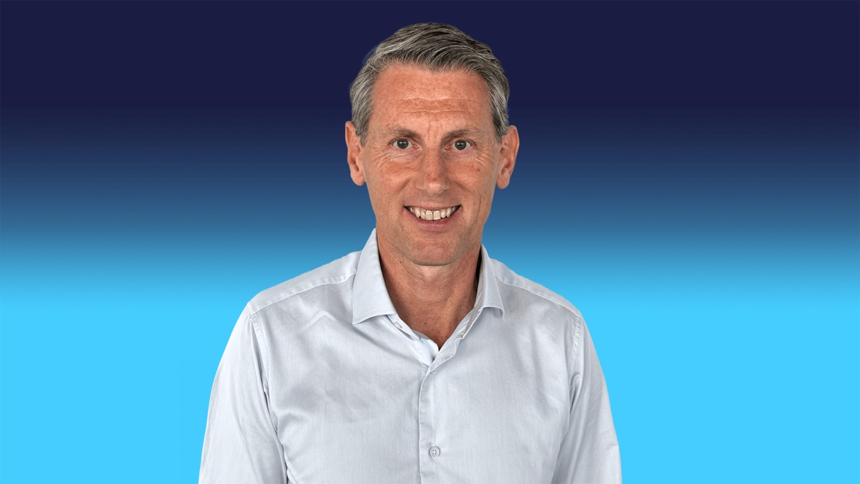 Lieven Debruyn headshot CEO of Octopus Capital wearing a blue shirt on a blue background