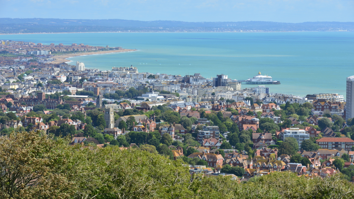Zoomed out view of a town near a beach